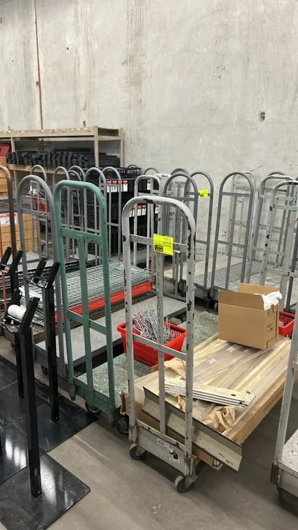 Metal diamond-plated U-boat carts. Features diamond plate deck and tubular steel end handles. 5'L. Mounted on casters. Contents not included.