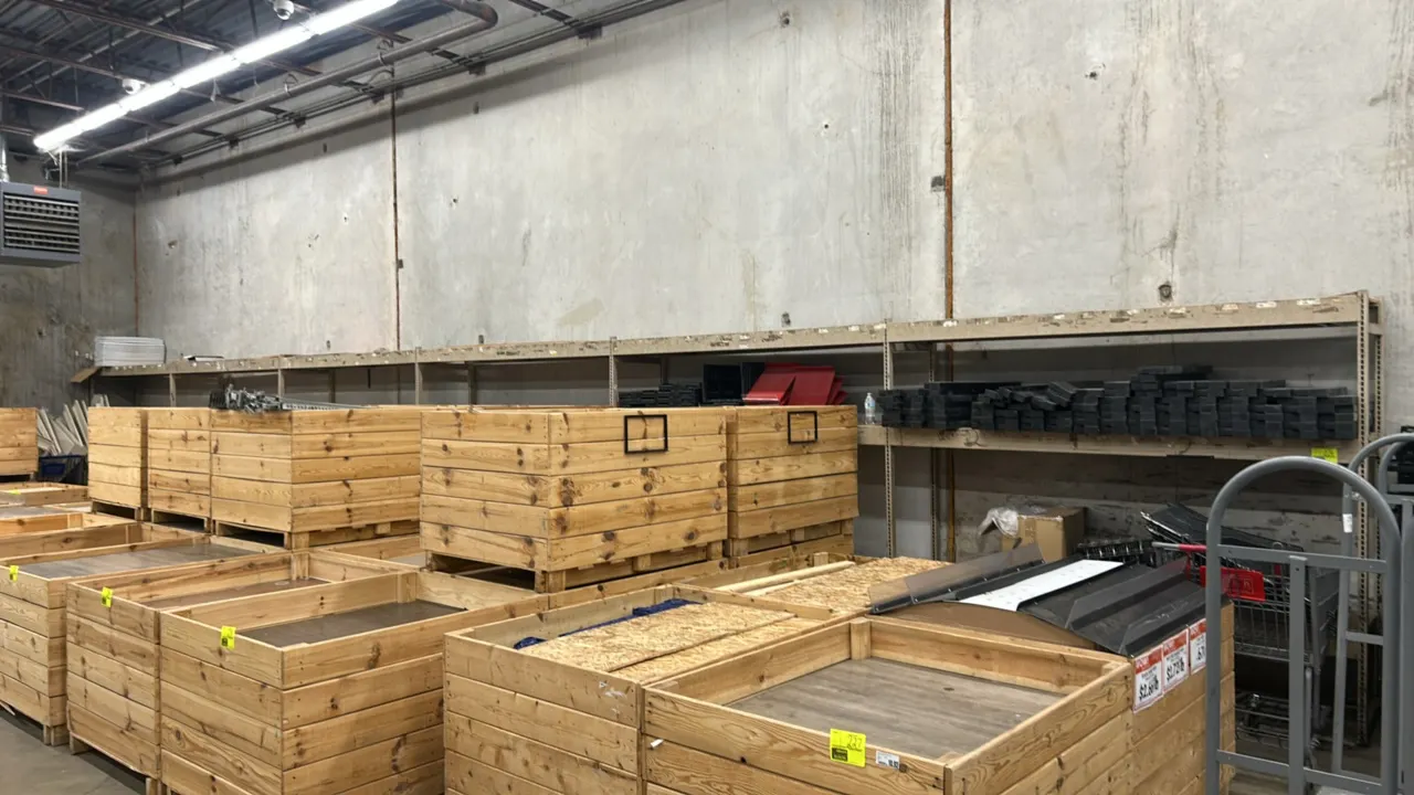 Metal warehouse racking. Features steel upright frames, horizontal crossbeams, and wood deck shelving. Dimensions: 8' x 2' each. Contents, wooden crat