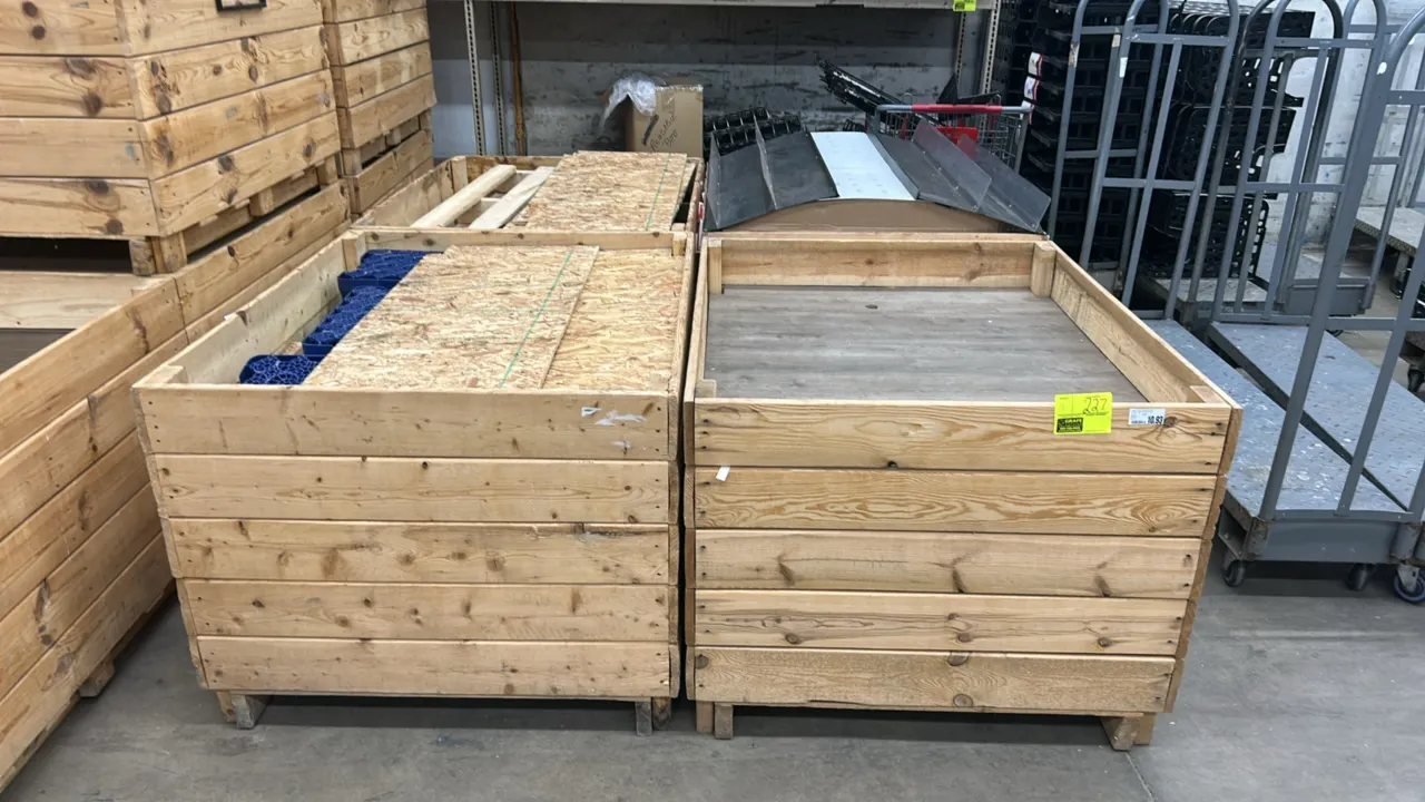 Wooden display dump bins. Features wood slat construction, open display wells, and integrated pallet-style bases. 48" x 40" each. Contents not include