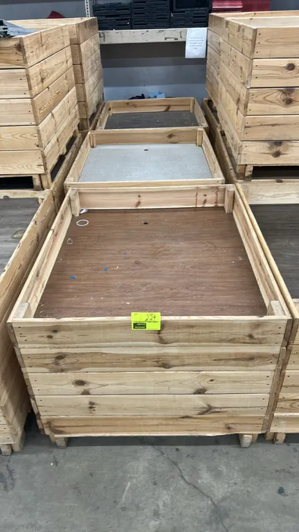 Wooden dump display tables. Features slatted wood construction, recessed woodgrain-finish display bottom with finger hole, and pallet-style base. 48"