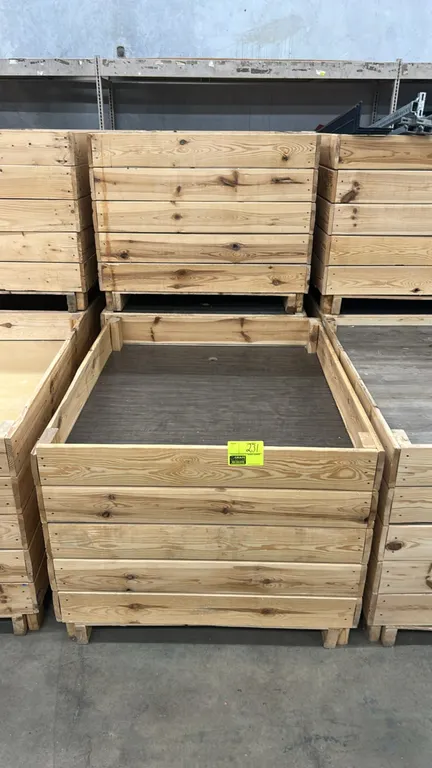Wooden retail dump bins. Features wood slat construction, dark faux-wood finish interior base, and pallet-style base. Dimensions: 48" x 40".