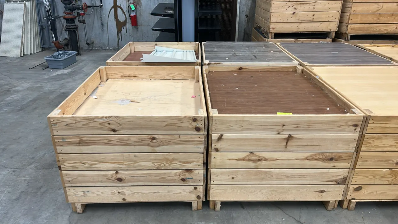 Wooden display dump bins. Features slatted wood construction, raised border edges, and pallet-style bases. 48" x 40". Contents not included.