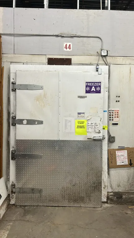 Walk-in freezer and walk-in cooler combination. Features foam insulated panels, pallet-sized entry doors with diamond tread kick plates, and interior