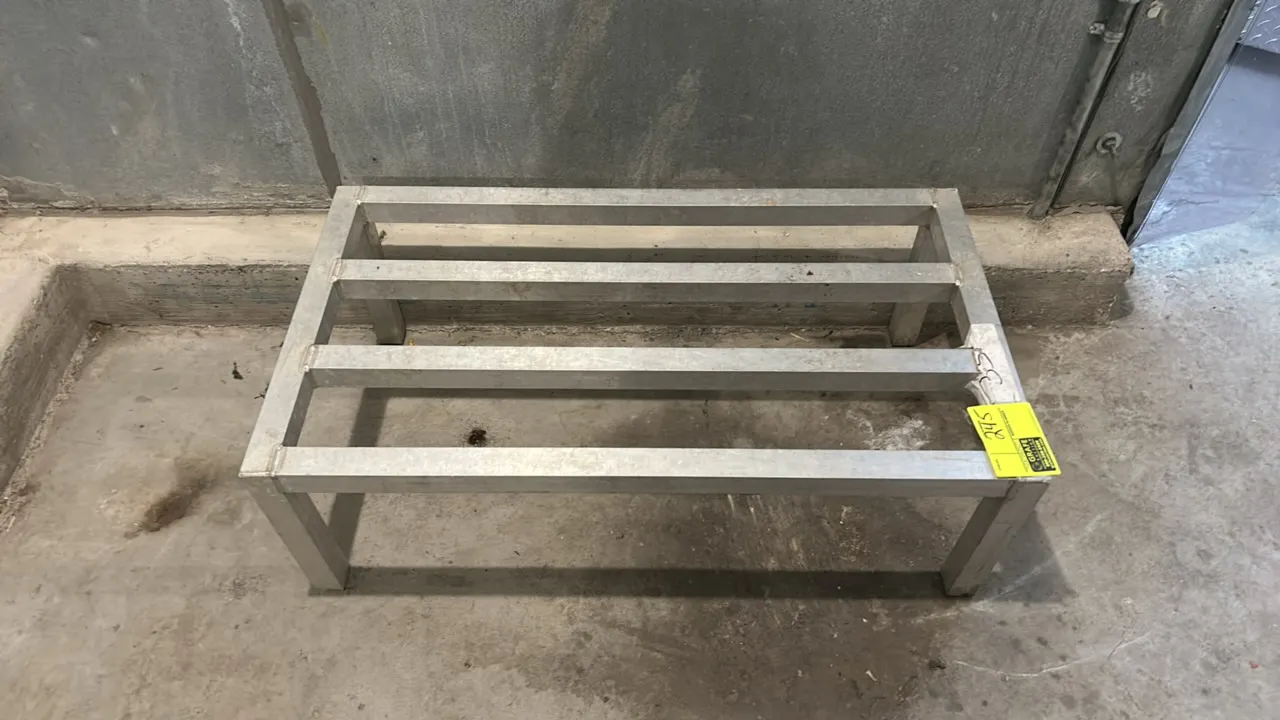 Aluminum dunnage rack. Features welded tubular aluminum construction with lateral top rails and stationary legs. 3'L.