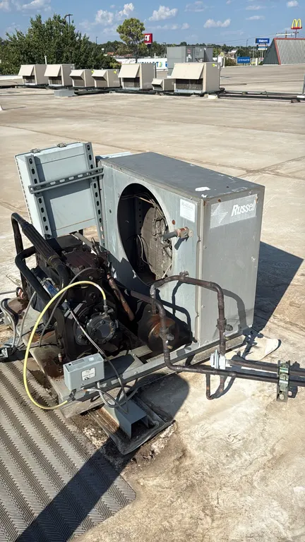 Russell low-temperature condensing unit. Features Copeland semi-hermetic compressor, air-cooled condenser, and electrical control box. Configured for