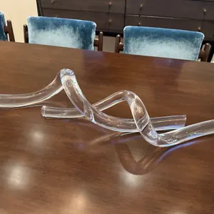 A SkLO Clear Glass Sculptural Decor Piece. (SkLO) An organic, fluid curved art glass sculpture featuring an etched "SkLO" signature at the base. Measu