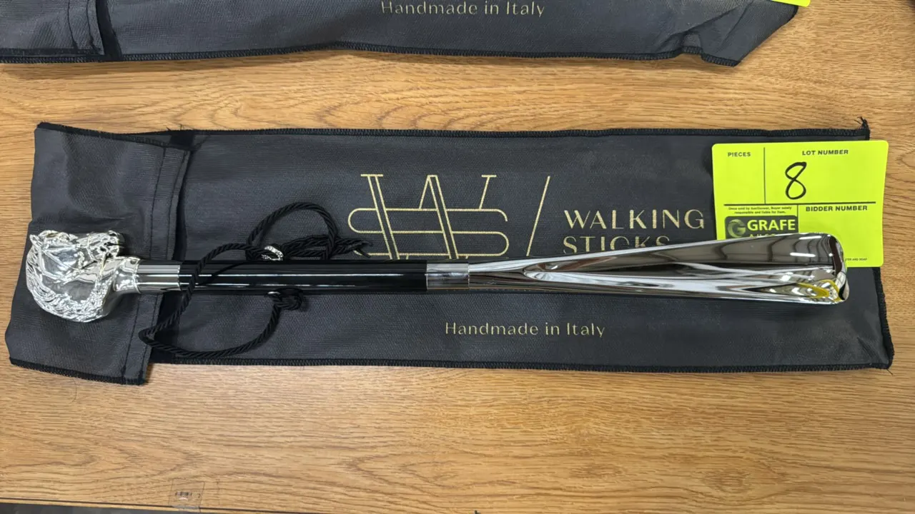 Walking Sticks horse-themed shoe horn. Features a silver-tone sculpted horse head handle, black shaft, polished chrome-finish shoe horn blade, and bra