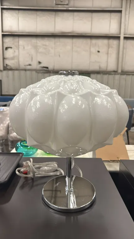 MM Lampadari Arabesque 16985L111 table lamp. Features a molded white glass shade and polished chrome stem and round base. Made in Italy. 14"H. Electri