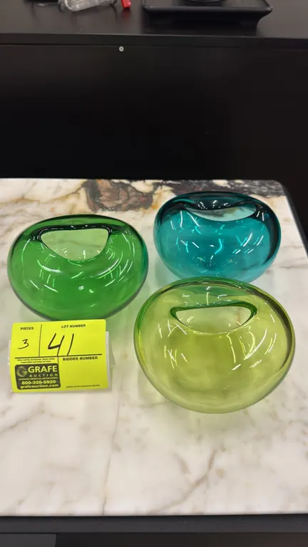 Global Views decorative glass vases. Features translucent colored glass construction in shades of emerald green, lime green, and teal, each designed w