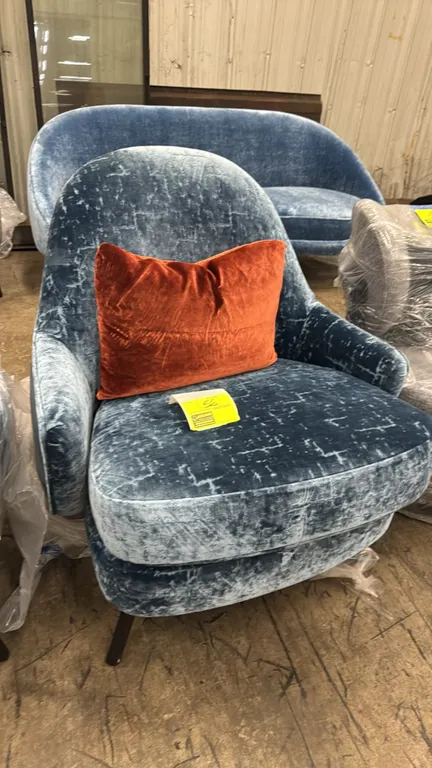 Hammer Fine Furniture custom upholstered lounge chair. Features blue crushed velvet style upholstery, contrasting smooth lower back, dark tapered legs