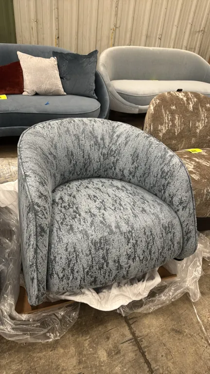 Bernhardt Design 6180 upholstered rocking chair. Features a curved barrel back, Métaphores Spuma textured fabric upholstery in Ardoise, and a dark woo