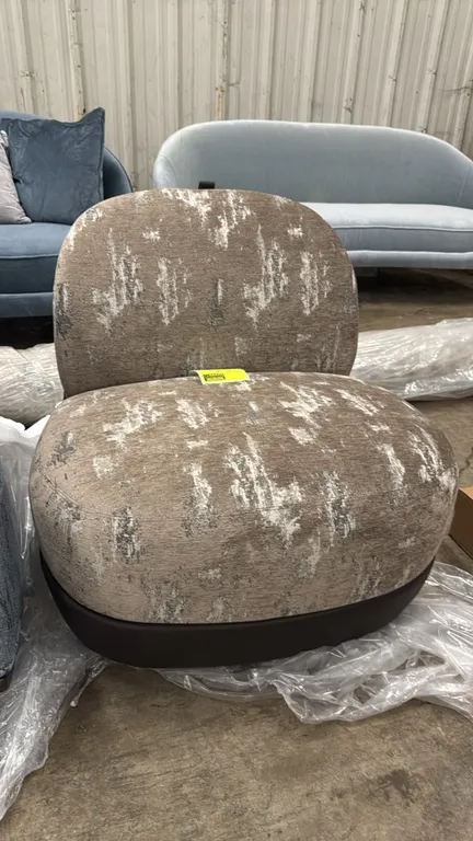 Bernhardt Design 5730W upholstered mobile lounge chair. Features textured patterned fabric upholstery, contrasting brown back and lower trim, and an i