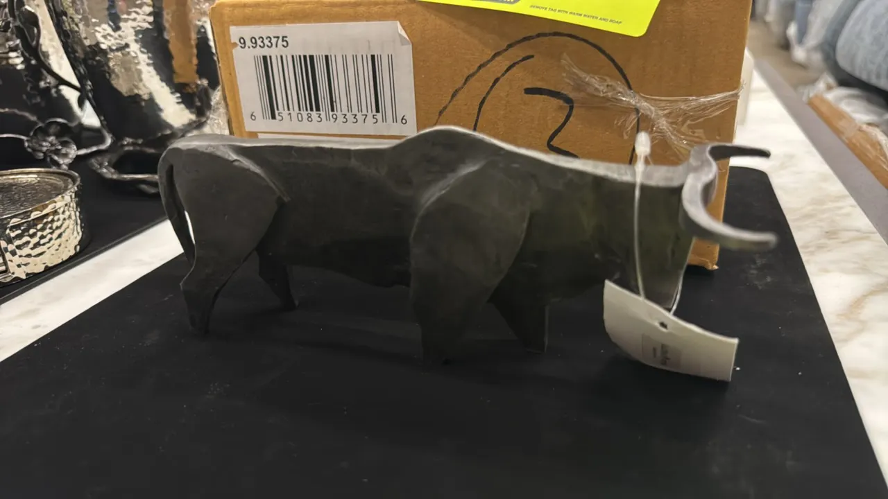 Global Views 9.93375 Steel Bull decorative sculpture. Features stylized steel construction with a natural iron finish. 8" x 4". Includes original box.