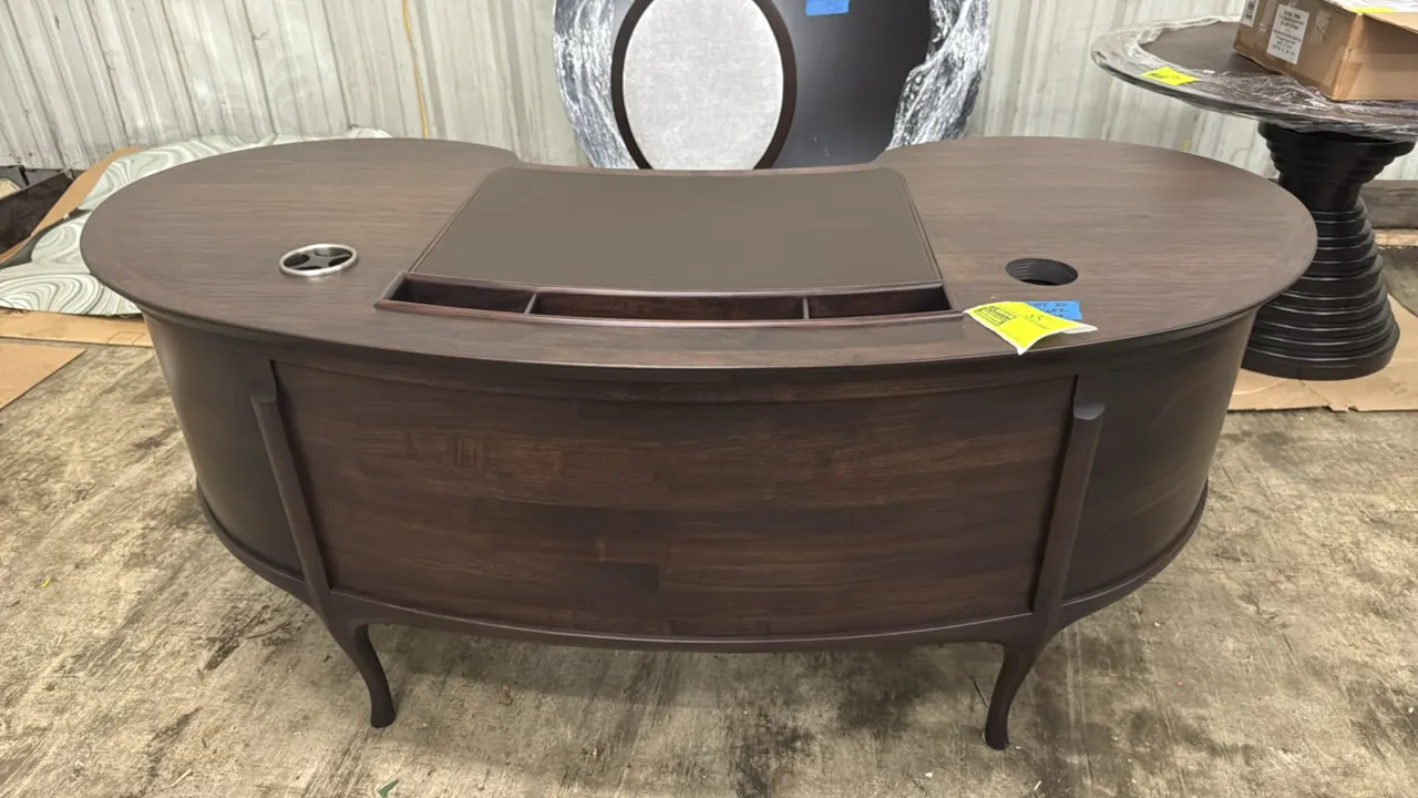 Ceccotti Collezioni Bean writing desk. Features American walnut construction with a curved bean-shaped top, inset leather desk pad, integrated accesso
