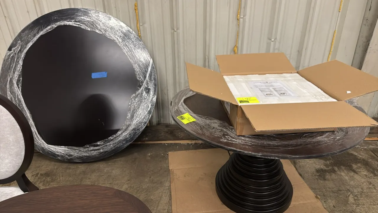 Hammer Fine Furniture Ibiza round table. Features a dark wood finish, round tabletop, and a tiered architectural pedestal base. 54" Dia. Note: Table t