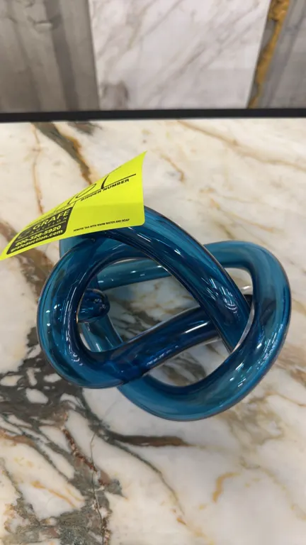 SkLO FL114SBL Wrap Object hand-blown glass sculpture. Features steel blue glass construction. 7". Made in Czech Republic. Includes original box. Backg