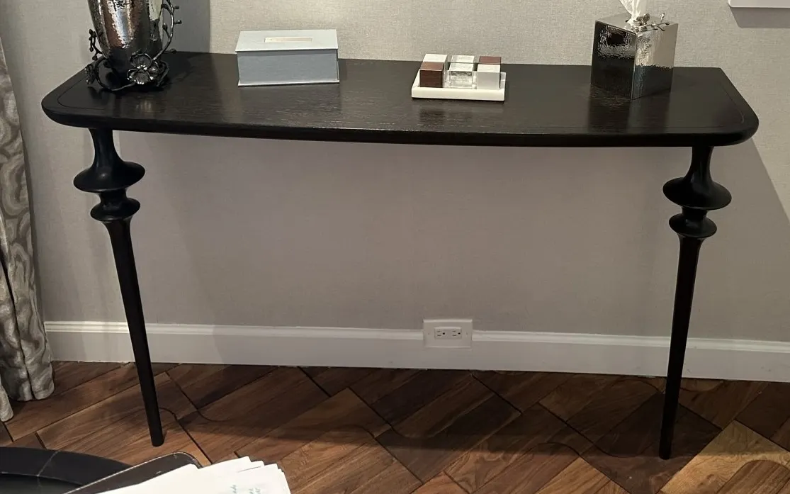 Arteriors wood wall-mount side table. Features a black wood finish, two support legs, wall-mounting brackets with hardware, and assembly instructions.