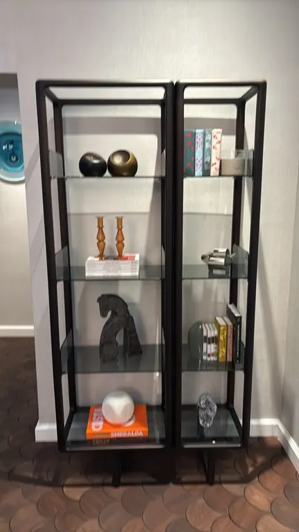 Porada Myria bookcase. Features smoked glass shelves and 2-piece construction. Dimensions: 39"x16"x80". Made in Italy. First two photos are reference