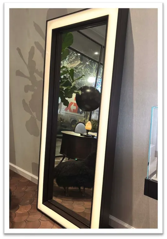 Lighted full length mirror. Features frosted illuminated perimeter border and brown stained wood frame. 36"W x 84"H.