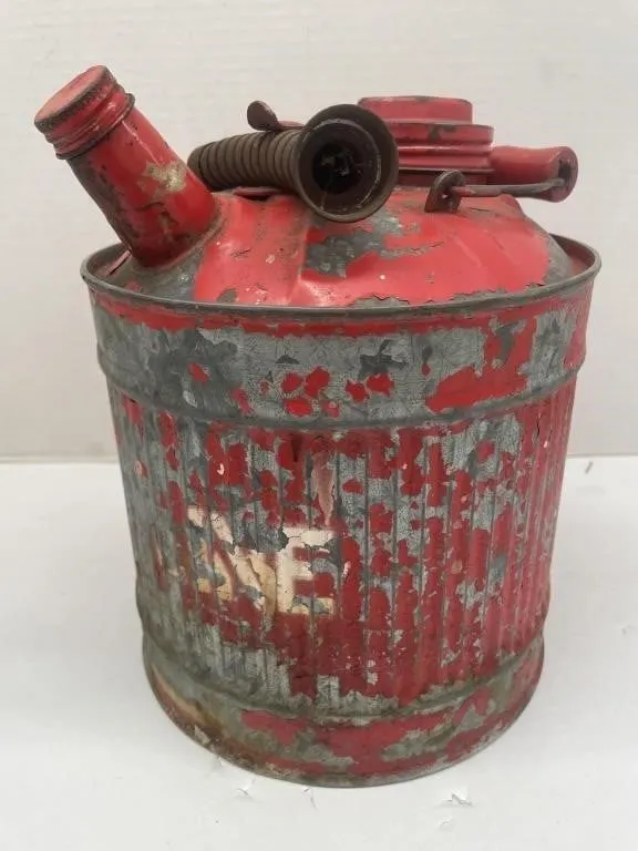 Vintage metal gas can with flexible spout.