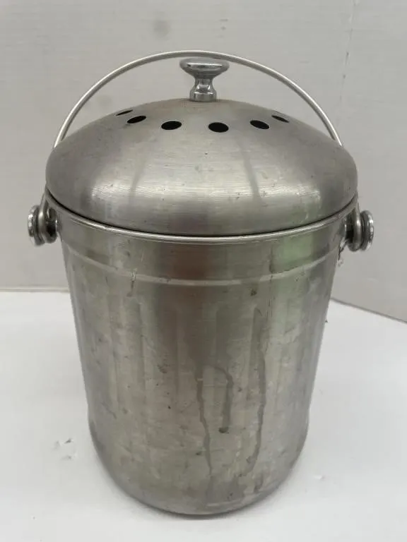 Stainless steel kitchen counter compost bucket.