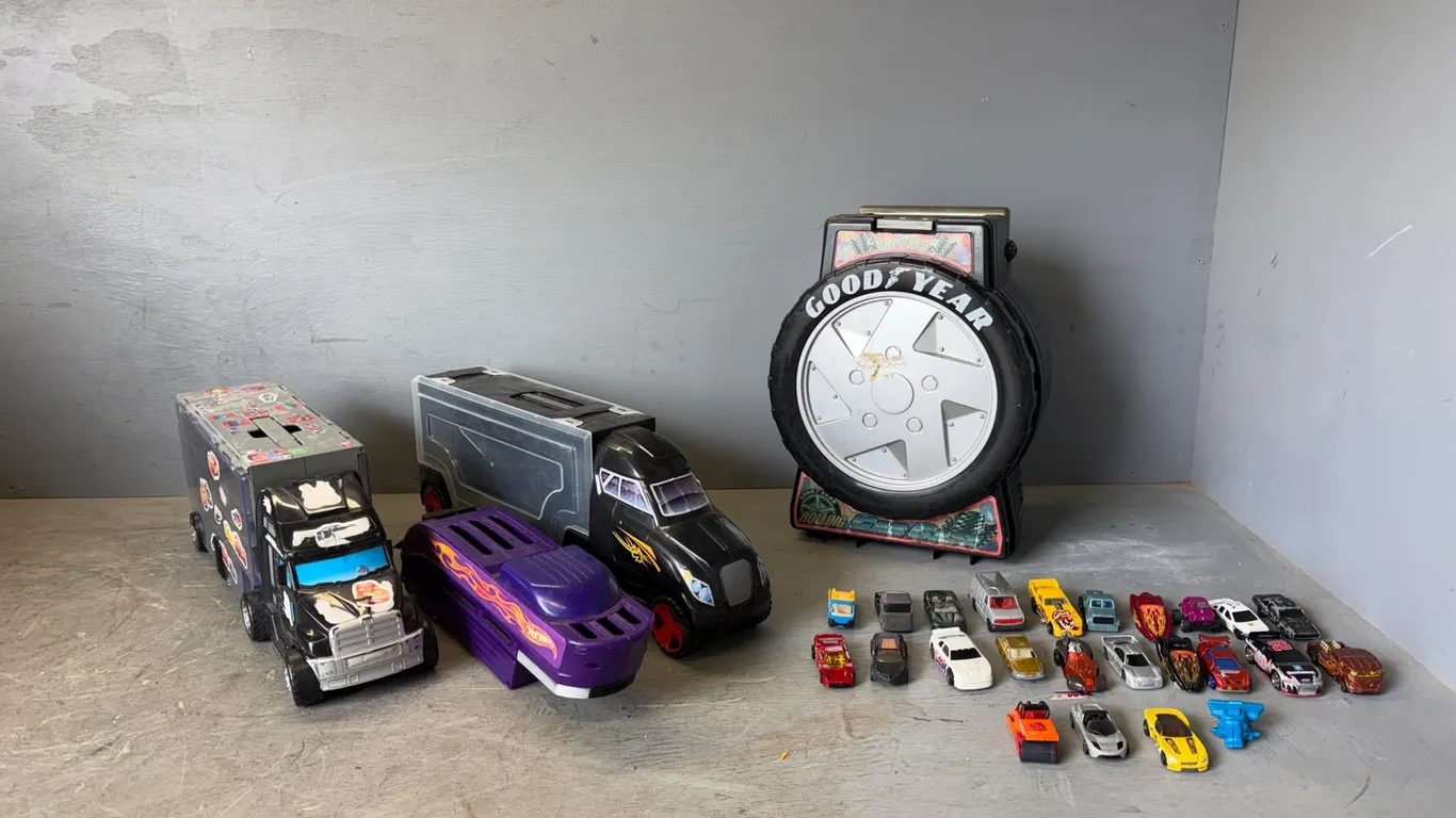 Assorted Hot Wheels Storage and Trucks w/ (24) Cars