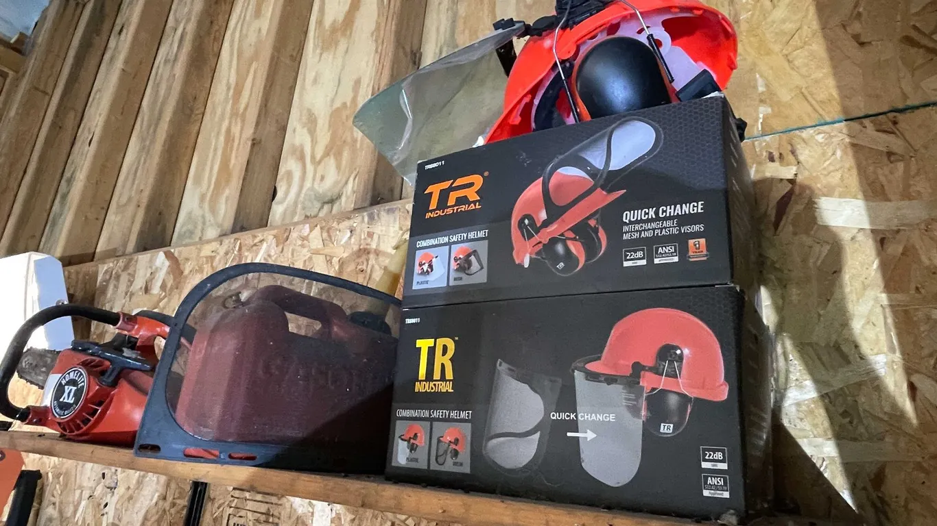 Homelite XL Chainsaw and (3) TR Industrial Helmets