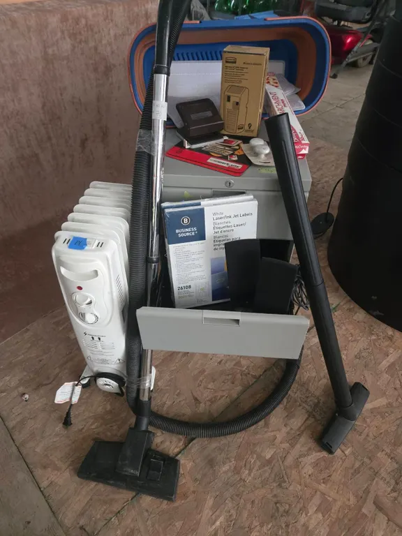Household Items: Oil Heater, Vacuum, Storage Bin, and Miscellaneous