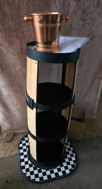 Round Display Stand With Copper Ice Bucket and White Tablecloths
