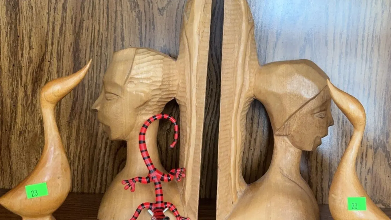 Carved Wood Bookends, Duck Figures, and Striped Gecko Figurine
