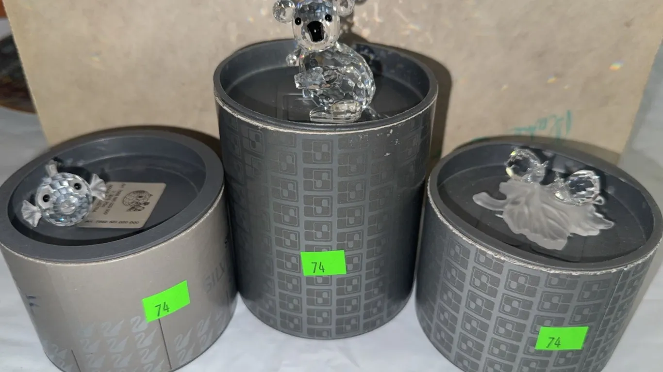 Swarovski Crystal Figurines Including Koala, Lion, and Fish with Original Cylindrical Boxes