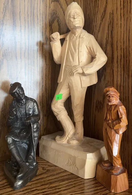Three Figurines Including Two Carved Wood Male Figures and One Metal Seated Man