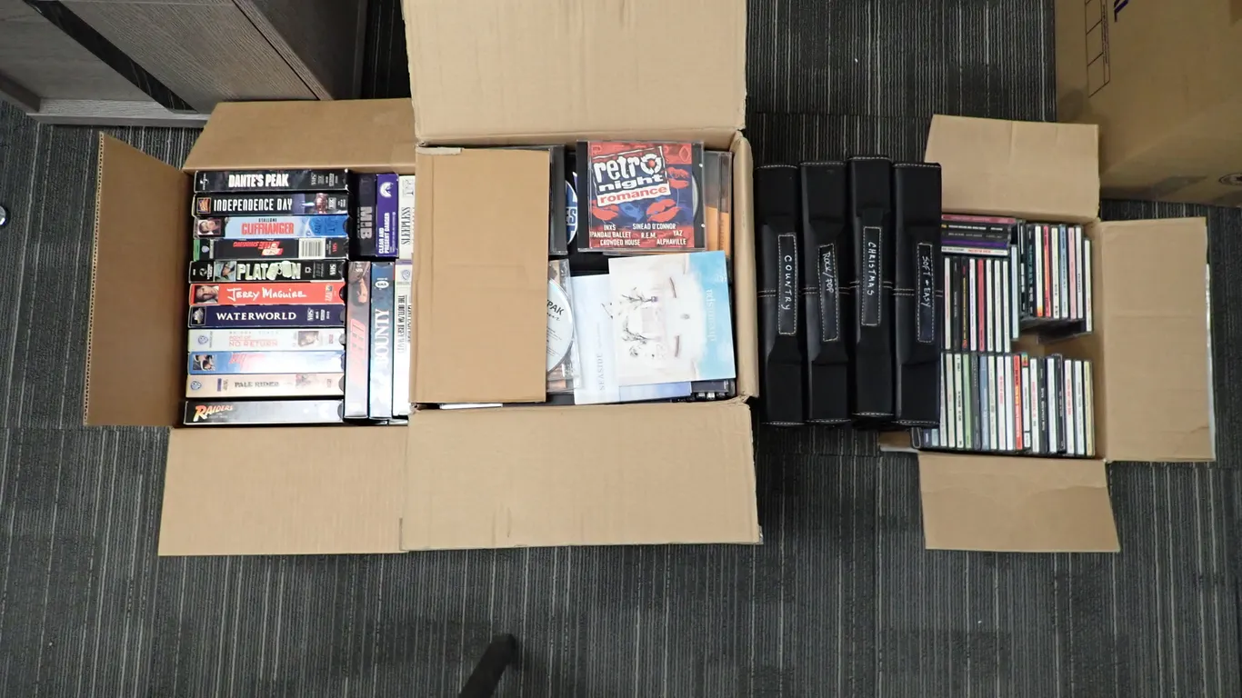 Lot of Asst. Music CD's and Movie VHS Tapes.