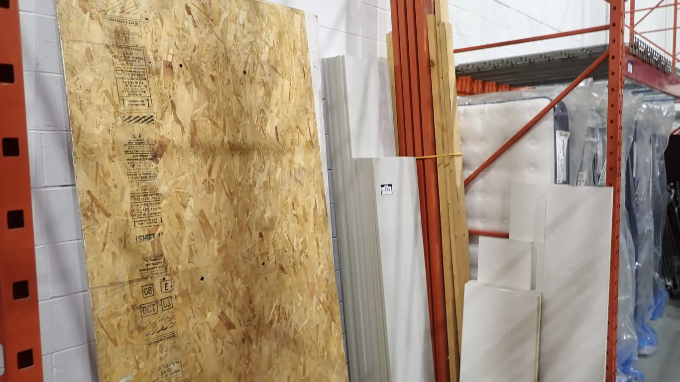 Lot of Asst. Plywood, Particle Board, 2x4's and Approx. (28)Laminated Shelves.
