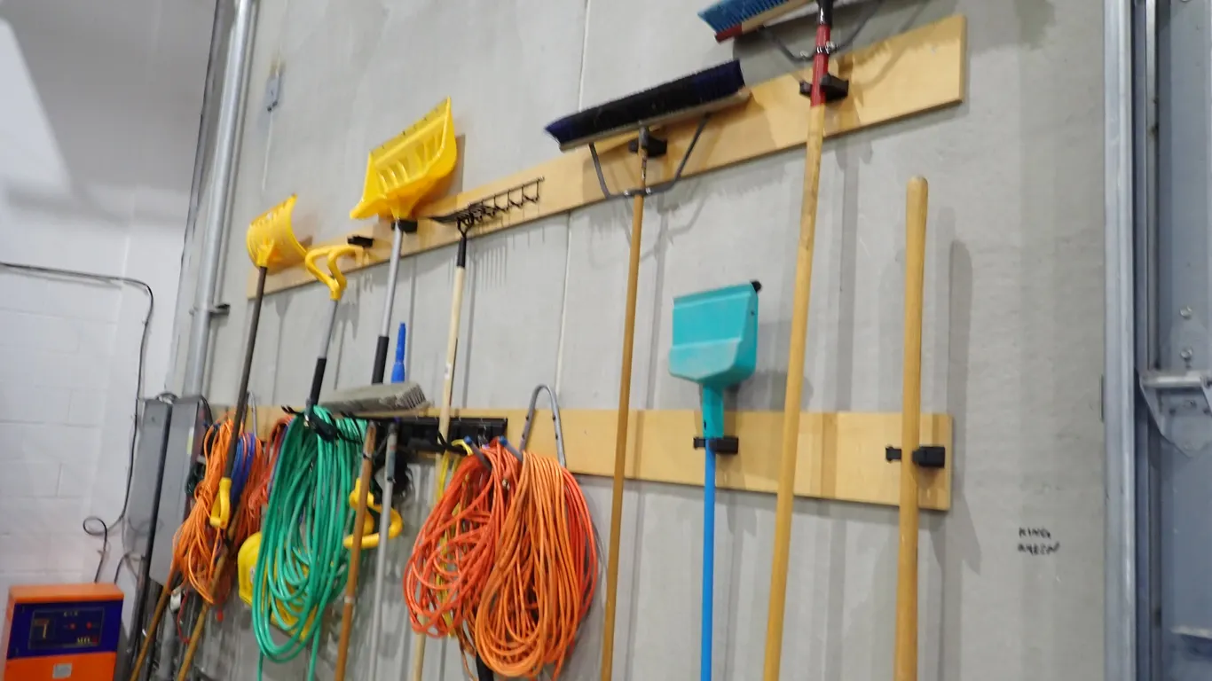 Lot of Asst. Brooms, Snow Shovels, Electrical Cords, Hose, etc.