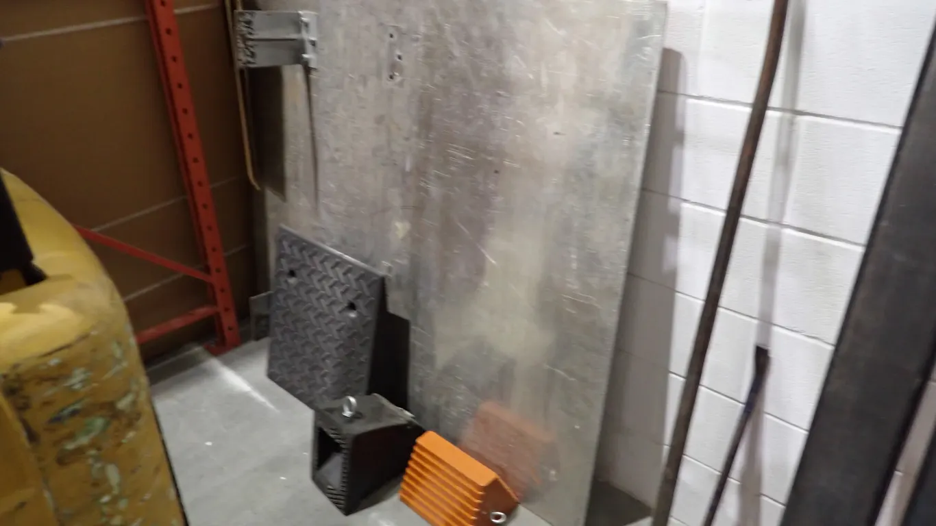 Lot of (2) Dock Plates and (3) Wheel Chocks.