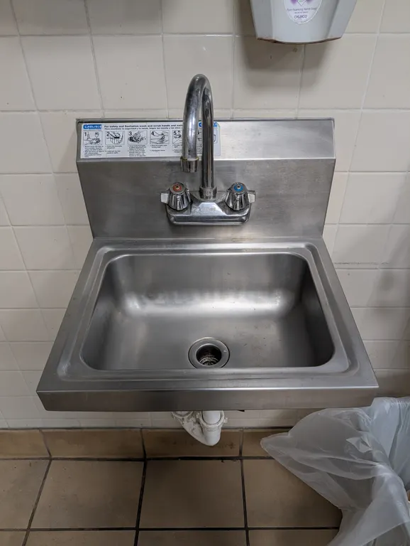 Carlisle Stainless Steel Wall Mount Haand Sink with Faucet and Drain - 17.25" x 15" x 20"