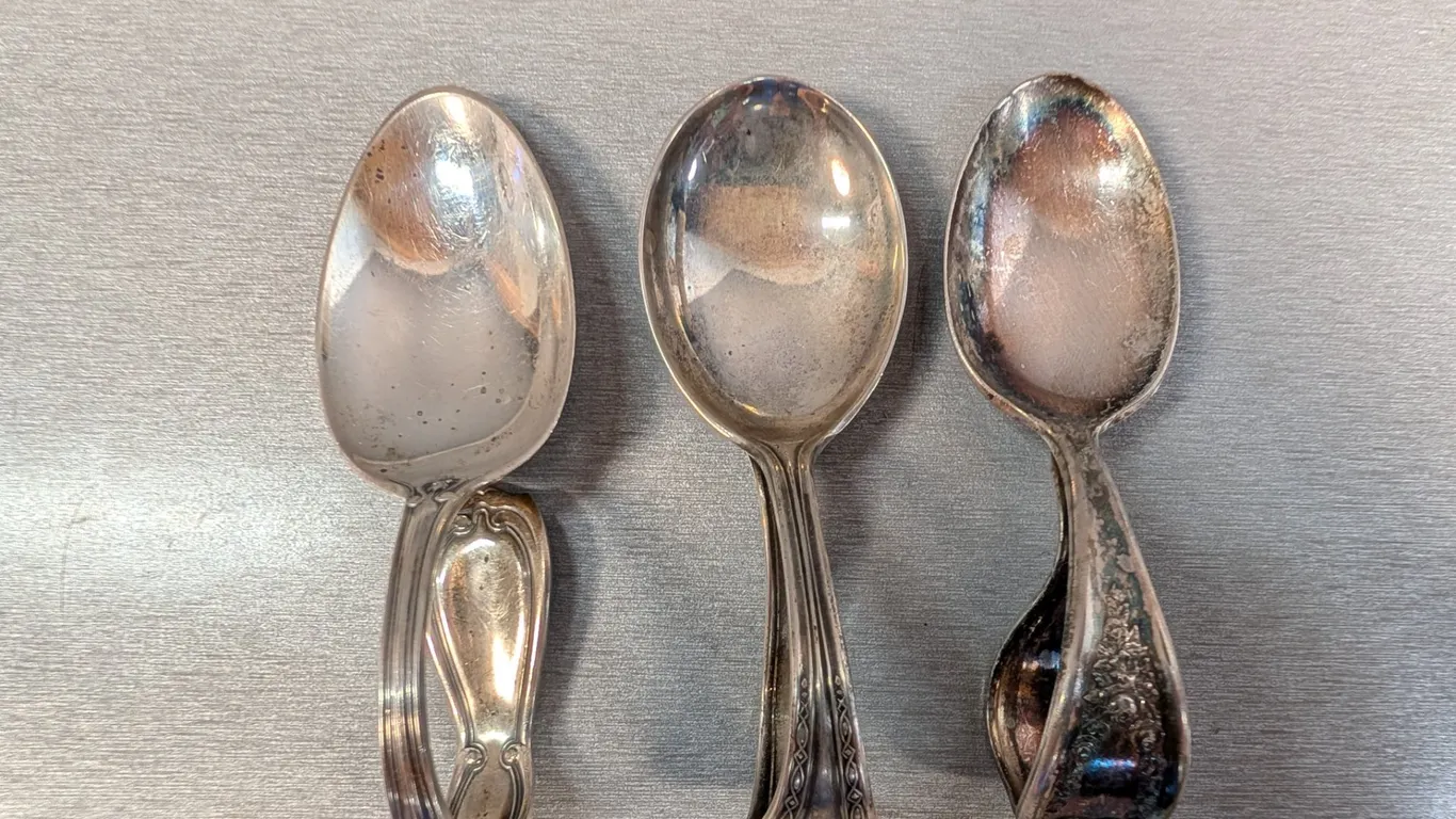 Sterling Spoons (2) and A Stainless Tea Caddy Spoons