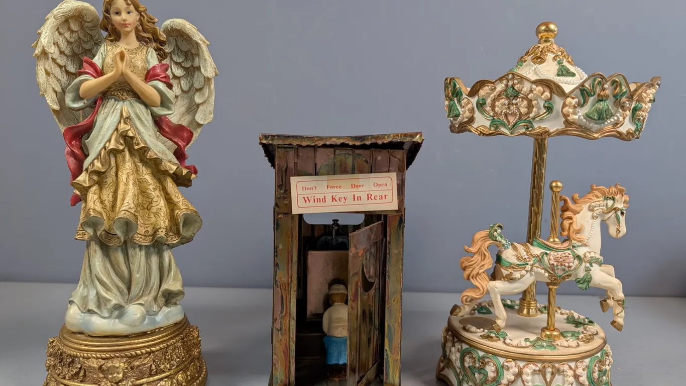 Collection of Three Musical Figurines: Angel, Outhouse, and Carousel