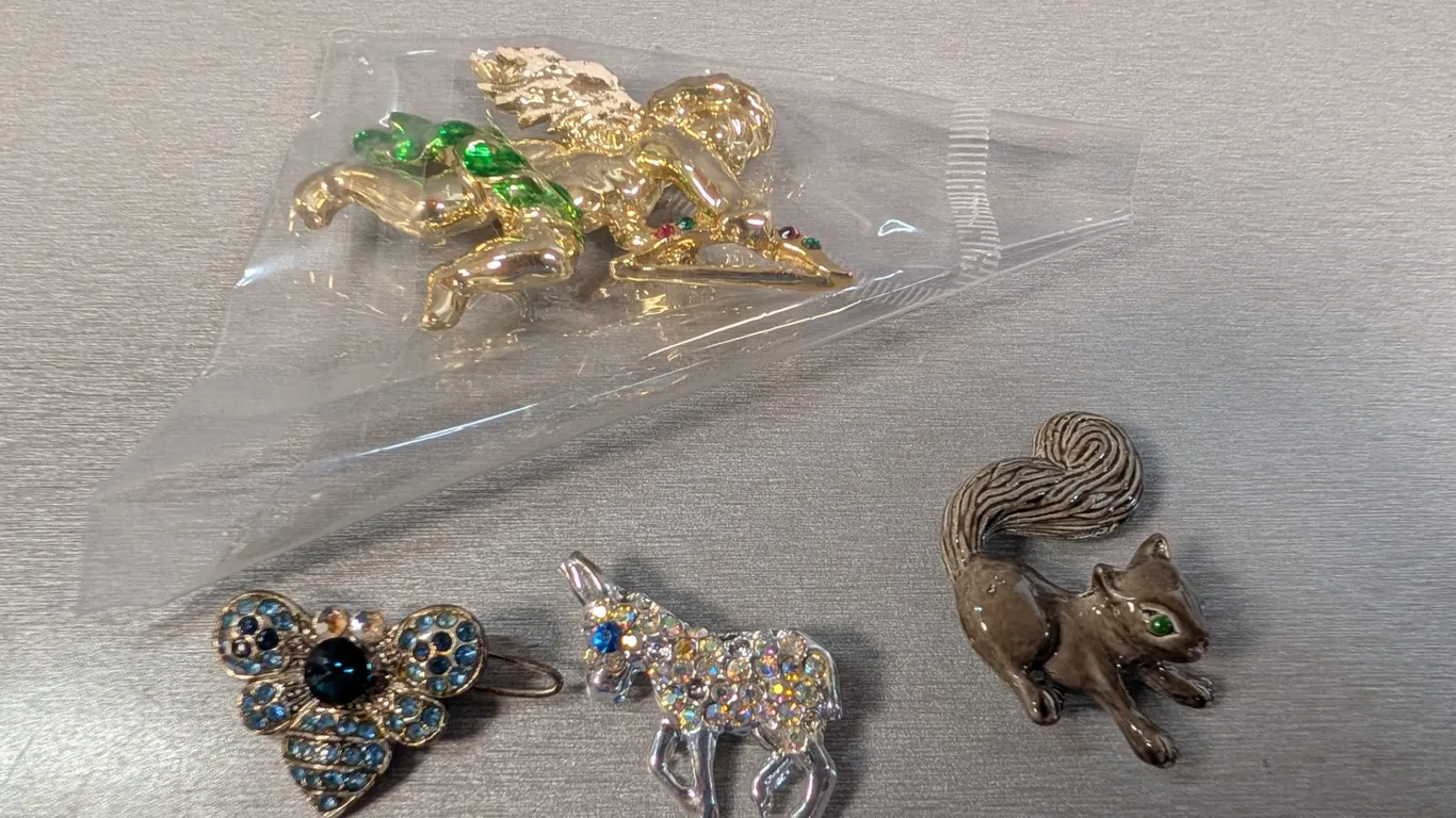 Collection of Four Figural Brooches