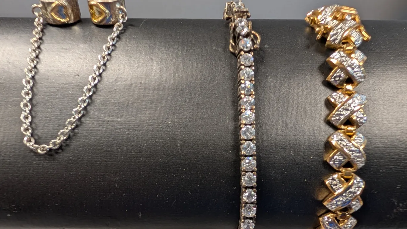 Collection of Two Sterling Silver Bracelets and One Bracelet Accessory