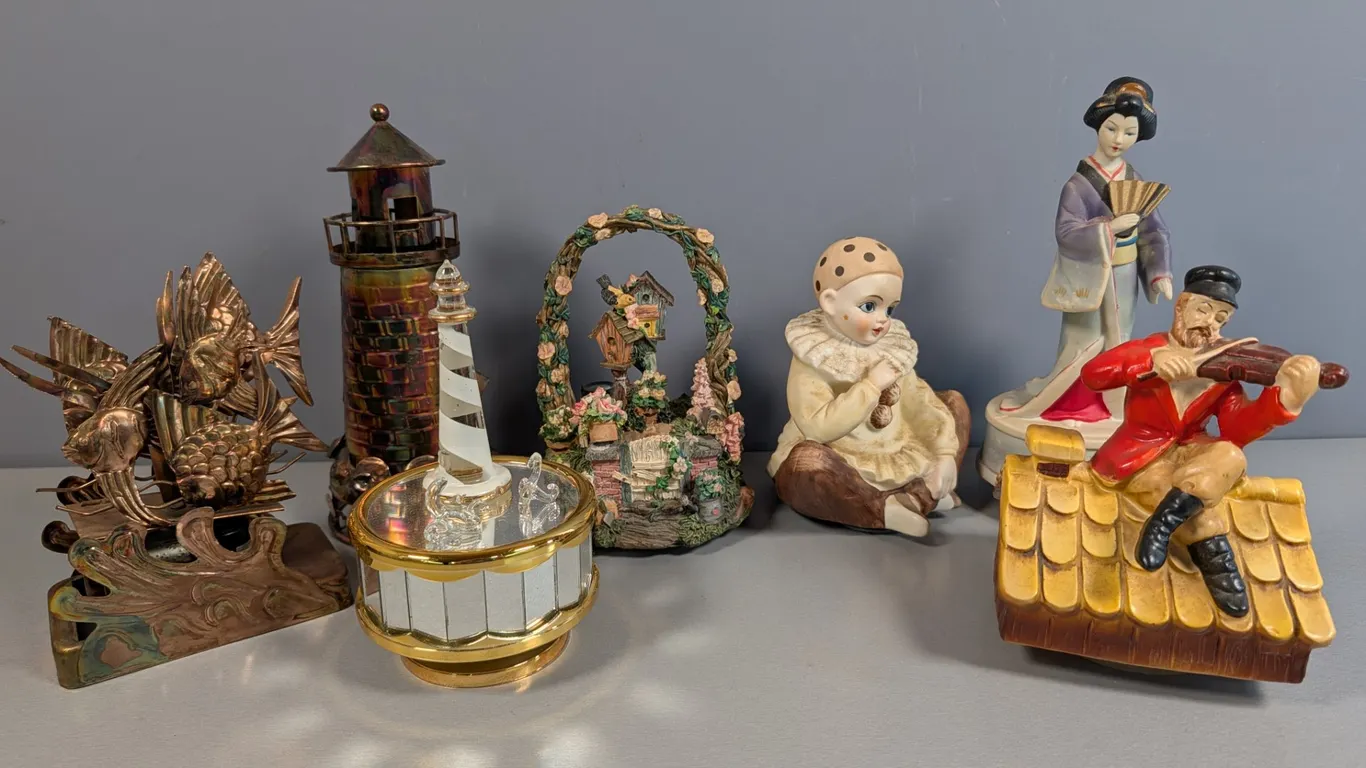 Collection of Seven Assorted Figural Music Boxes