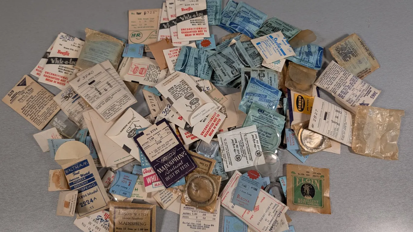 Large Assortment of Vintage Watch Mainsprings, Crystals, and Parts