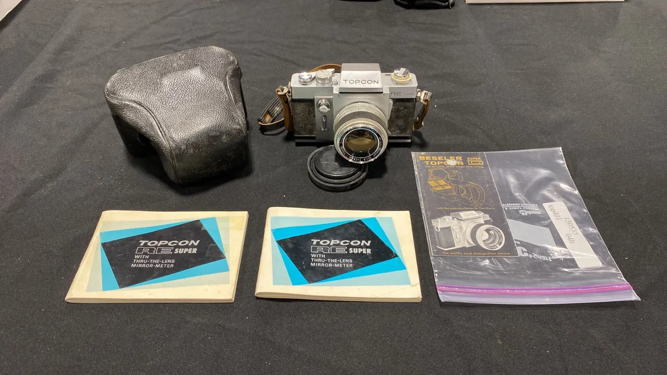 TOPCON RE SUPER WITH THRU-THE-LENS MIRROR-METER 35MM FILM CAMERA (CHROME BODY)