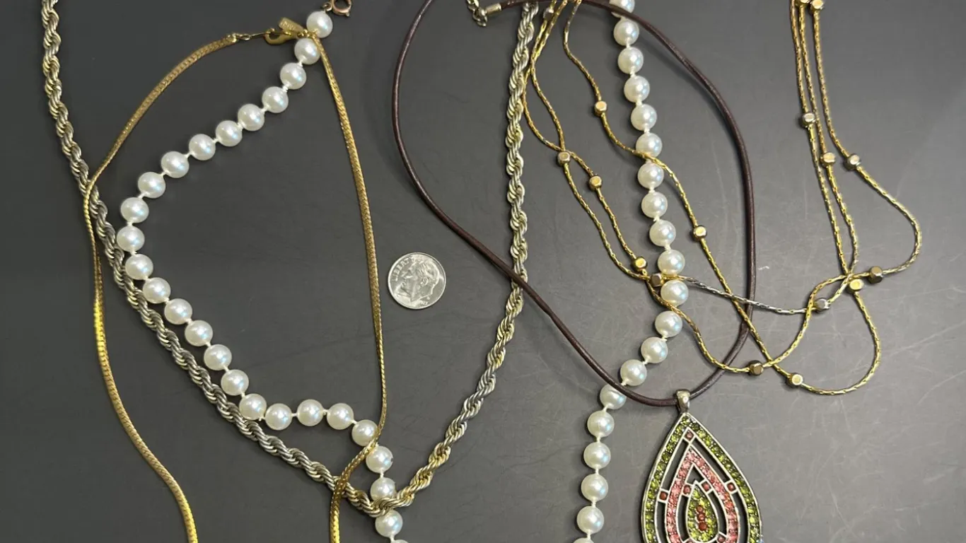 Jewelry Lot Featuring Necklaces with Beads, Chains, and Pendant