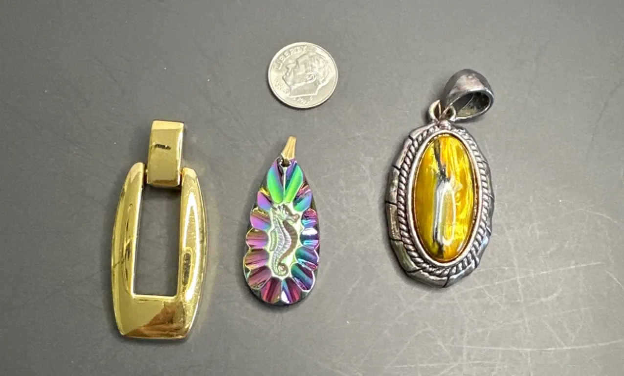 Three Pendant Jewelry Pieces from Unknown Eras