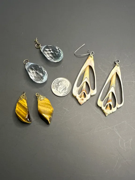 Three Pairs of Earrings Featuring Shell, Tiger's Eye, and Glass Drops