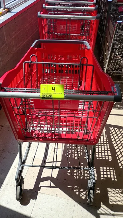 Technibilt poly shopping carts. Features red polymer basket, gray metal tubular frame with lower tray, folding child seat, and push handle. Mounted on