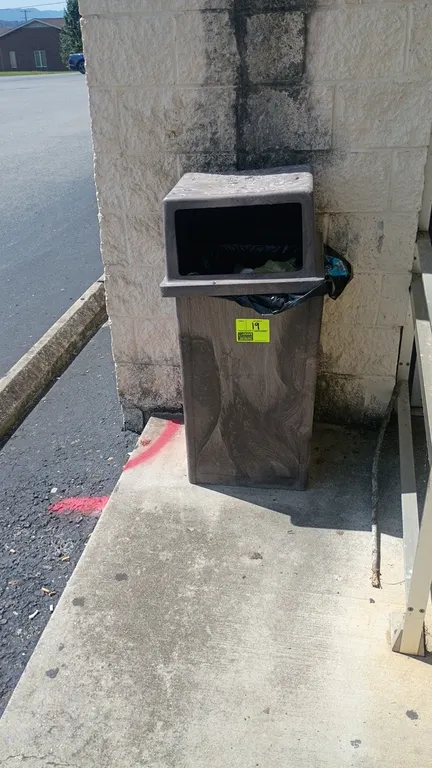 Polyethylene trash cans. Molded plastic construction with removable lids. Includes one brown open-front receptacle and one gray receptacle with swing