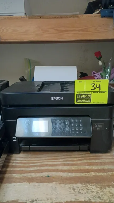 Epson WorkForce WF-2850 all-in-one wireless printer. Features automatic document feeder, digital display panel with keypad controls, and rear paper fe